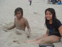 Deion and Rachel playing in the sand