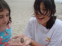 Camille and Amber playing with sand crabs
