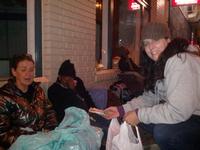 Sharon handing out socks to the homeless