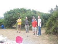The boys playing jungle bocce ball