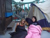 Stephanie and Alexis sleeping on the boardwalk