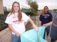 Kelsey and Hannah picking up trash on Benton