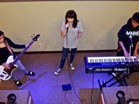 Ayla leading youth worship team practice with Alexie and Shim