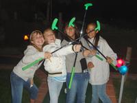 The girls playing mini-golf