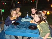 Sara, Alicia, Carmen, and Camille munching on some pizza