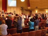The congregation praying for our missionary Glen Chapman