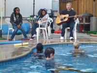 Les leading worship by the pool