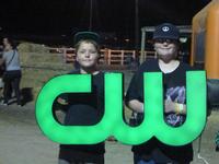 Donald and Brandan holding up the CW sign