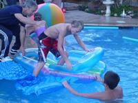 Ryan using inflatable water shoes to walk on water