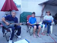 Les leading worship by the pool