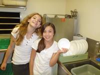 Ande and Rachel help clean dishes