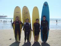 Robert, Alexa, Tricia, and April getting ready to surf
