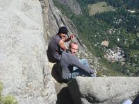 Edmund and Dan with feet hanging over the cliff