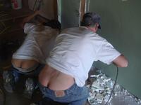 Two Mexican plumbers we hired to help us.