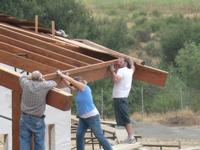 Dan, Danijela, and Eric working on the facia