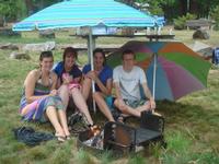 Kim, April, Jelena, and Chris trying to warm up during the rain storm