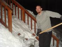 Eric shoveling snow off the stairs