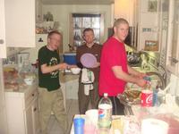 Chris, Tim, and Chris washing dishes
