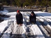 Redneck sledding behind the car