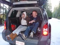 Rheann and Chris pulling sledders from the back of the car