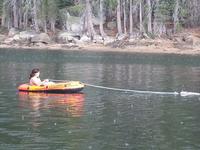 Ashley being pulled by Chris' remote control boat, right before epic hail storm