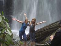 Laura and Alaina going for a dip under the falls.