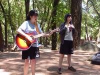 Camille and Carmen leading worship at Uvas Canyon