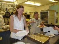 Kim and Harvey working the kitchen