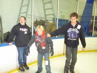 Emily, Ryan, and Kevin working on their skating skills