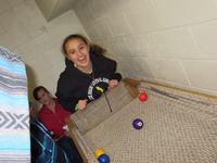 Donya playing carpet ball